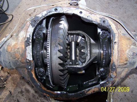 1989 Ford F-150 - Close-up of a vehicle's differential assembly, revealing internal gears and housing.