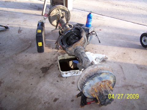 1989 Ford F-150 - Rear axle assembly removed from vehicle, showing differential and brake drum.