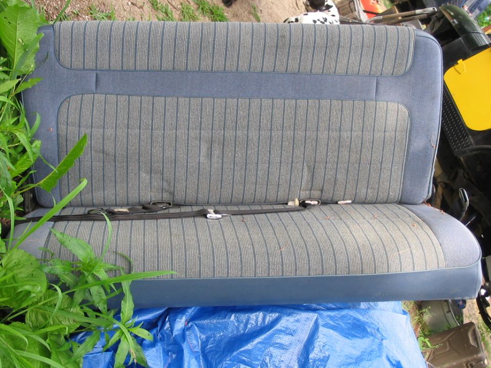 Blue striped bench seat with seatbelts
