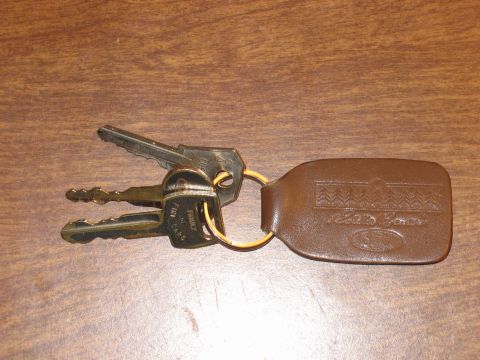 1991 Ford Bronco - A set of keys with a leather fob, possibly for an Eddie Bauer edition vehicle.