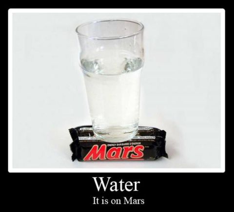 1990 Ford Bronco - A glass of water is balanced on two Mars bars, playing on the word 'Mars'.