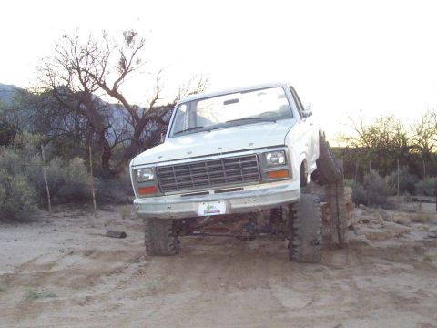 1981 Ford F-150 - This modified Ford F-150 is positioned with its front tires on rocks, its off-road capabilities.