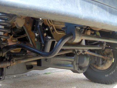 1995 Ford Bronco - Undercarriage view of a 1995 Ford Bronco, highlighting the front suspension and differential components.