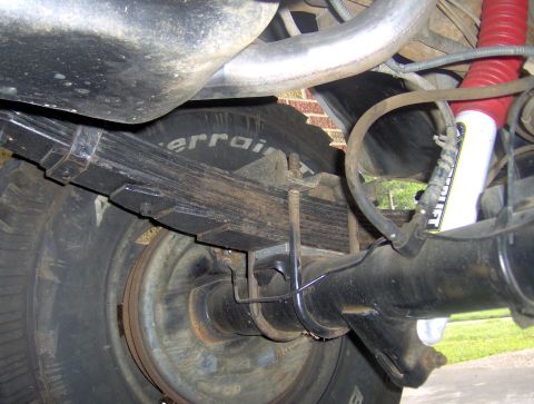 1995 Ford Bronco - Rear suspension components including leaf springs and a red shock absorber are visible.