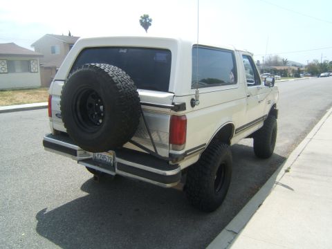 1988 Ford Bronco - Rear view of a 1988 Ford Bronco, showing the spare tire mounted externally.
