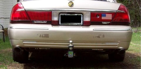 2000 Mercury Grand Marquis - Rear view of a 2000 Mercury Grand Marquis showing the bumper, trailer hitch, and badging.