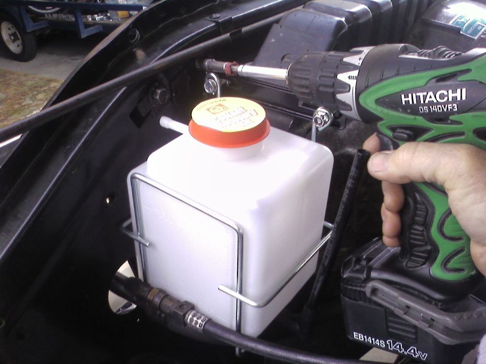 Hitachi drill installing a windshield washer fluid reservoir