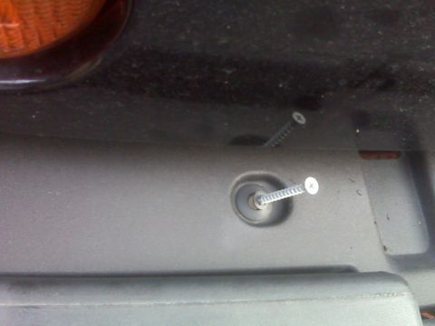 2008 Jeep Wrangler - Close-up of screws in plastic trim, with a Supermotors.net watermark at the bottom right.