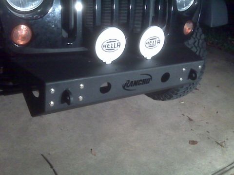 2008 Jeep Wrangler - Close-up of a Jeep's front bumper, auxiliary lights and tow hooks.