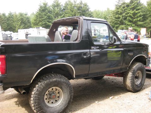 1979 Ford Bronco - This black SUV has a lifted suspension and off-road tires, suggesting it is modified for off-road use.