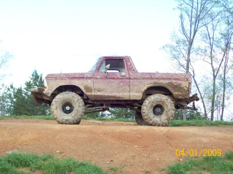 1978 Ford Bronco - This heavily modified 1978 Ford Bronco is shown covered in mud, ready for off-road action.