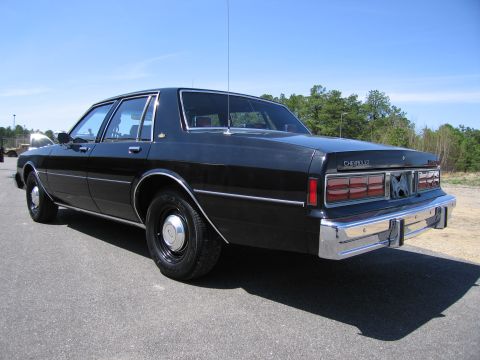 1991 Ford LTD Crown Victoria - This Chevrolet sedan has a distinctive rear end with chrome bumper and horizontal taillights.