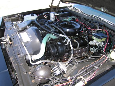 1991 Ford LTD Crown Victoria - Engine bay of a car, showing various mechanical parts and wiring.