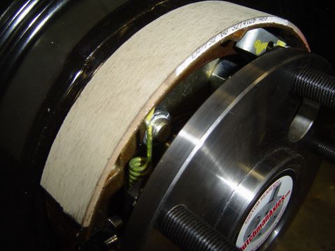 1989 Ford Bronco - Detail of a brake drum and shoes, a sticker for DutchmanAxles.com.