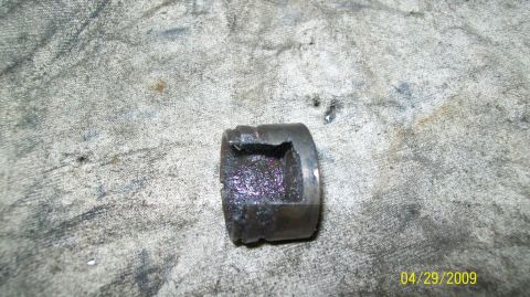 1973 Ford Ranchero - Close-up of a damaged U-joint bearing cap, showing signs of wear and metal fatigue.