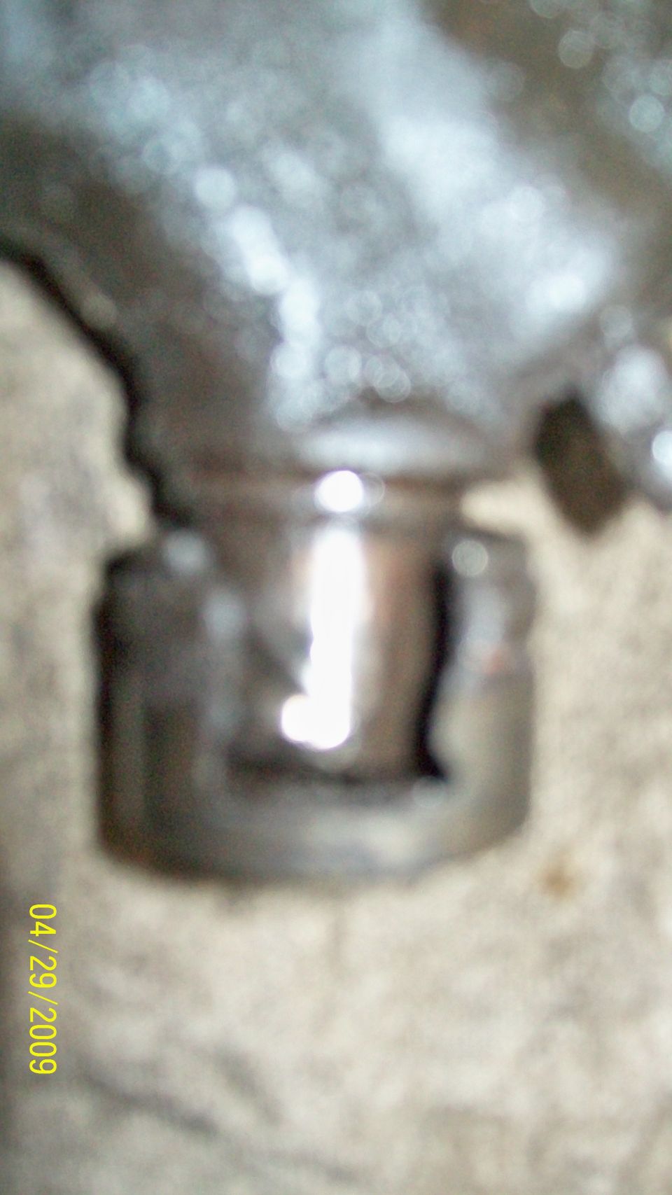 close-up of a u-joint with a date stamp of 04/29/2009