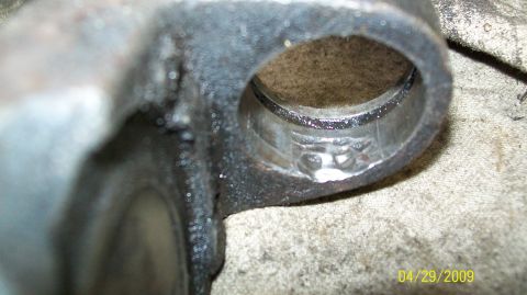 1973 Ford Ranchero - This close-up shows a worn U-joint bearing race, indicating potential damage to the drivetrain component.