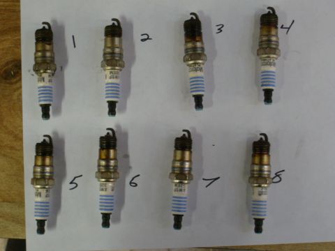 1992 Ford Bronco - Eight spark plugs are displayed and numbered, indicating a potential engine issue or maintenance check.