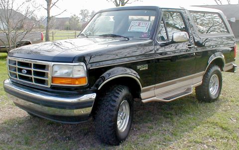 1983 Ford Bronco - This black Ford Bronco has a "For Sale" sign in the window and tan trim details.