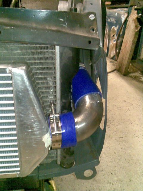 1969 MINI Cooper - Custom intercooler piping is installed, connecting to the radiator assembly.