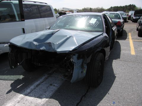2001 Ford Crown Victoria - This 2001 Ford Crown Victoria sustained significant front-end damage, including a crumpled hood and missing bumper.