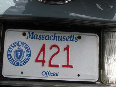 2001 Ford Crown Victoria - Close-up of a Massachusetts State Police license plate with the number 421.
