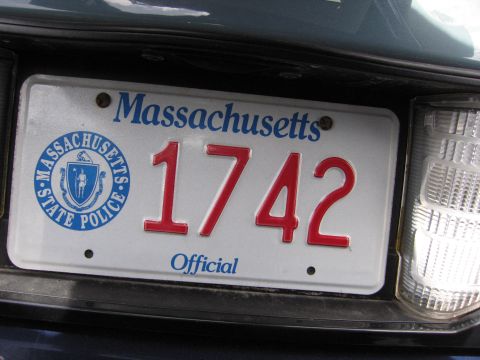 2001 Ford Crown Victoria - Close-up of a Massachusetts license plate showing the number 1742 and the State Police emblem.
