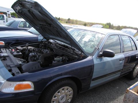 2001 Ford Crown Victoria - Ford Crown Victoria with hood open, parked outdoors with another vehicle behind it.
