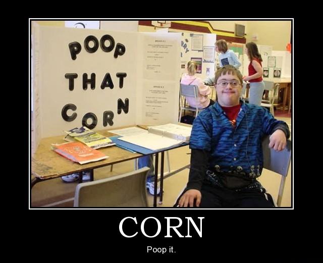 Boy at a science fair display reading POOP THAT CORN, captioned CORN