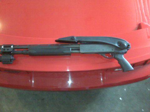 2004 Ford Mustang - Shotgun with tactical light accessory.