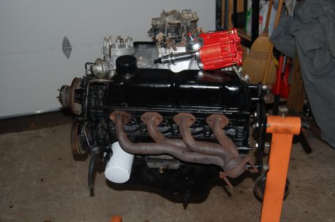 1994 Ford Bronco - Engine on an orange stand, a red distributor cap and black block. The registry claims it is a 1994 Ford Bronco, but this is incorrect.