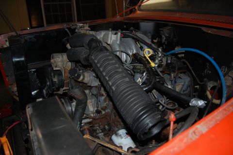 1994 Ford Bronco - Close-up view of an engine bay, showing the air intake system and other engine parts.
