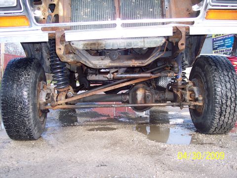 1979 Ford Bronco - The front suspension and differential of a 1979 Ford Bronco are visible in this undercarriage shot.