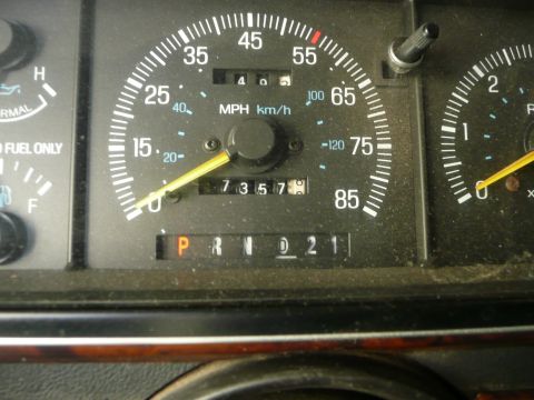 1991 Ford Bronco - Close-up of a vehicle's dashboard gauges, including the speedometer and odometer.