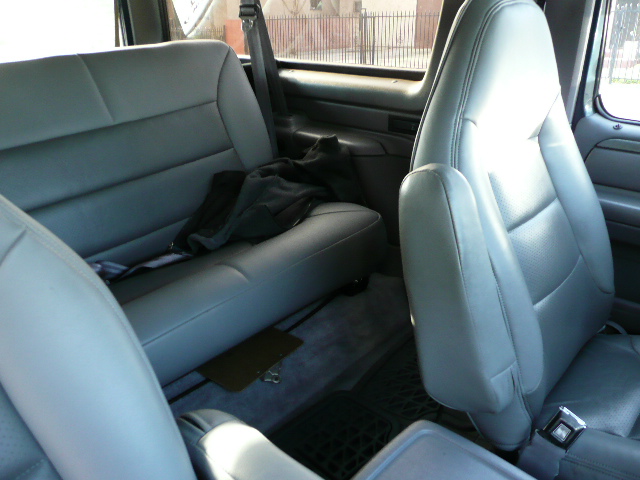 Interior shot of a vehicle's back seats and center console