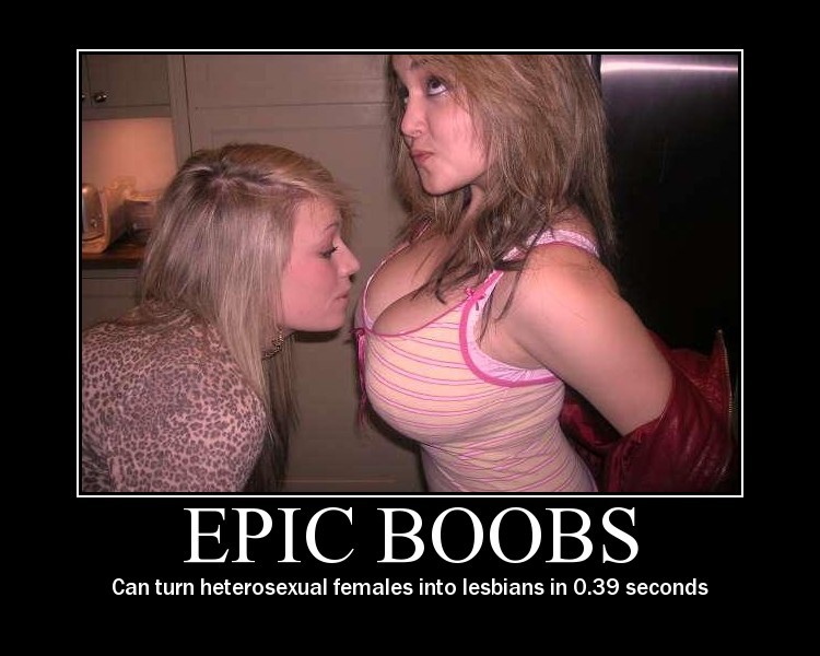 Two women in a room, one leaning towards the other's chest. Text below reads 'EPIC BOOBS'