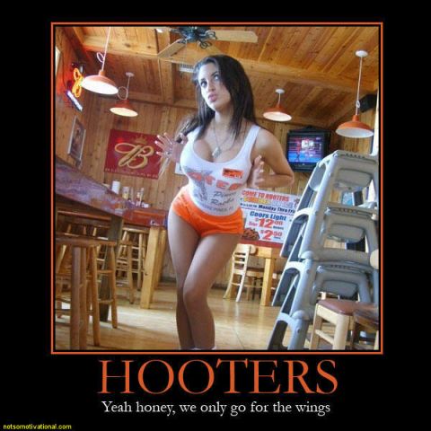 1990 Ford Bronco - A woman in a Hooters uniform poses in the restaurant.