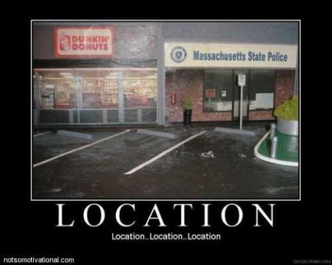 1990 Ford Bronco - A building with a Dunkin' Donuts and a Massachusetts State Police station is shown.