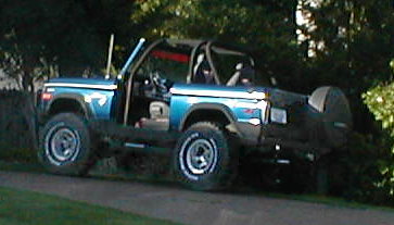 1983 Ford Bronco - This 1983 Ford Bronco is shown with its top removed and a spare tire mounted on the back.