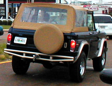 1983 Ford Bronco - This Ford Bronco is a classic SUV with a removable soft top and a rear-mounted spare tire.