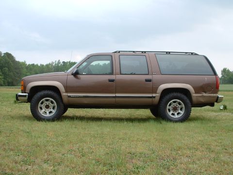 1994 GMC Suburban - BLING! H2s inside 305/70R17 Maxxis Bighorns (34").......a little big. Yes in this picture it is STOCK. NO twist on the t-bars. So far only…
