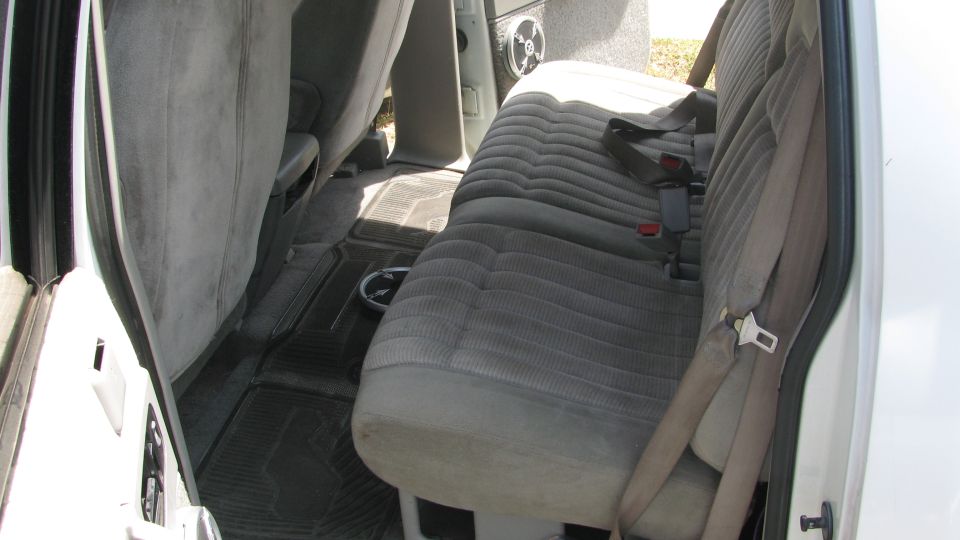 Interior view of truck rear seats and floor mats