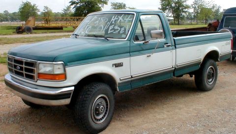 1983 Ford Bronco - This 1995 Ford F-250 pickup truck is shown from the front three-quarter view, with text visible on the windshield.