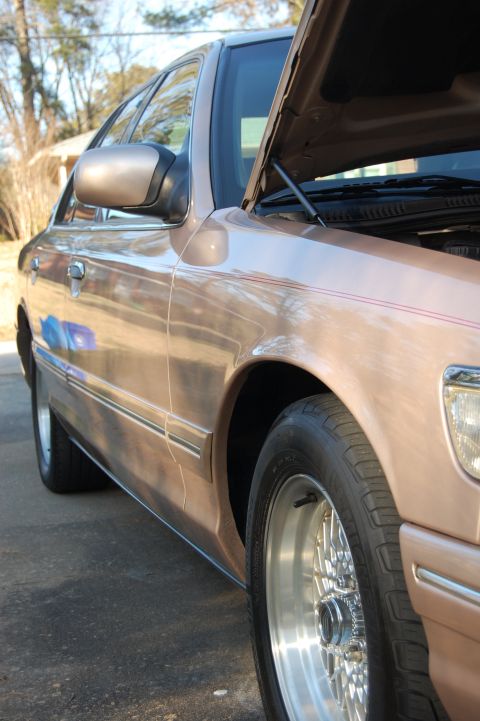 1996 Mercury Grand Marquis - This 1996 Mercury Grand Marquis is shown from the front 3/4 view with its hood open.
