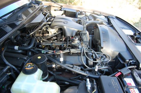 1996 Mercury Grand Marquis - Close-up view of a V8 engine bay, showing various components and wiring harnesses.