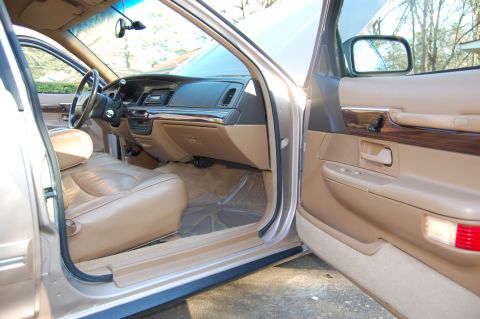 1996 Mercury Grand Marquis - The interior of a car, showing the driver's seat, dashboard, and door panel.