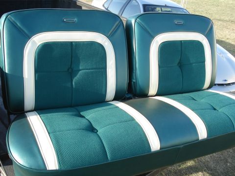 1979 Ford F-150 - Interior bench seat with green and white upholstery, likely from a classic vehicle.