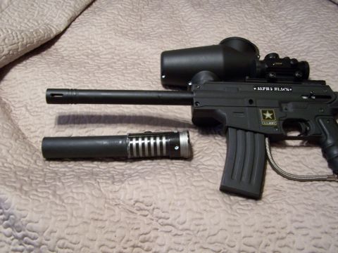 1986 Ford Bronco - Paintball marker with U.S. Army markings and "ALPHA BLACK" text.