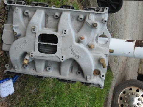 1966 Ford F-100 - Close-up of an Edelbrock intake manifold, showing its dual carburetor ports and cast branding.