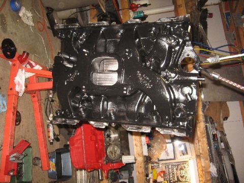 1966 Ford F-100 - Engine block being worked on, mounted on an engine stand in a workshop.